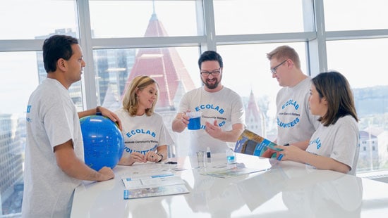 A group of Ecolab employees working on a community project - Ecolab Community Involvement