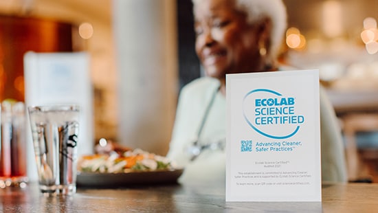 Ecolab Science Certified table tent on a dining table in a long term care facility
