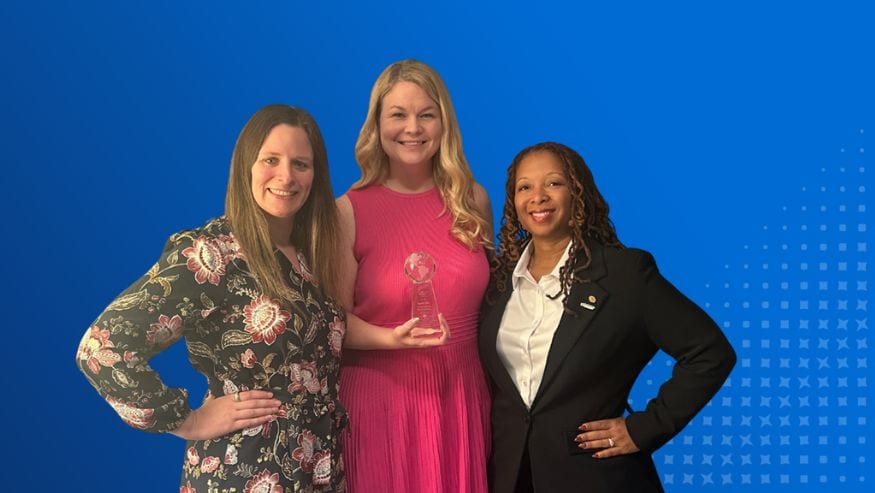 Whitney Mason, Melissa Walker, and Sherica Matthews holding GEN IMPACT's Top 10 Enterprise-wide list award from the Global ERG Network.