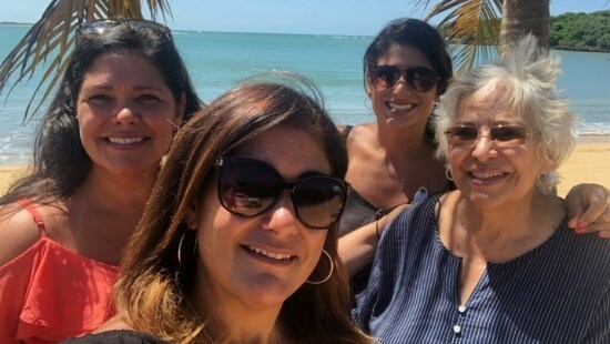 Group of women standing on beach - Ecolab