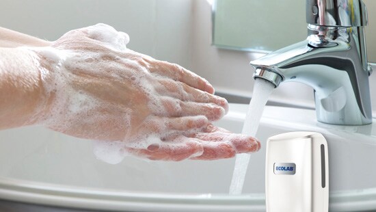 Washing hands under faucet