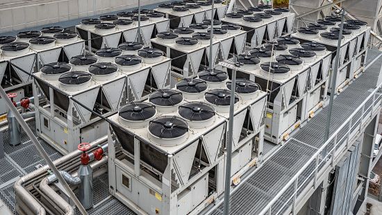 Rows of adiabatic cooling units on a rooftop